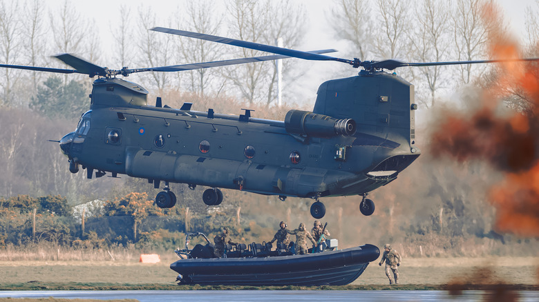 Chinook helicopter picks troops up from a boat