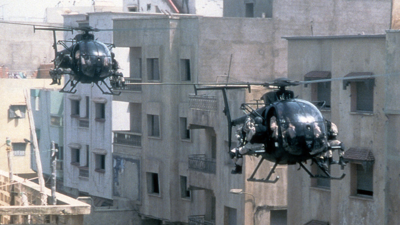 Two helicopters approach combat in the 2001 film 'Black Hawk Down.'