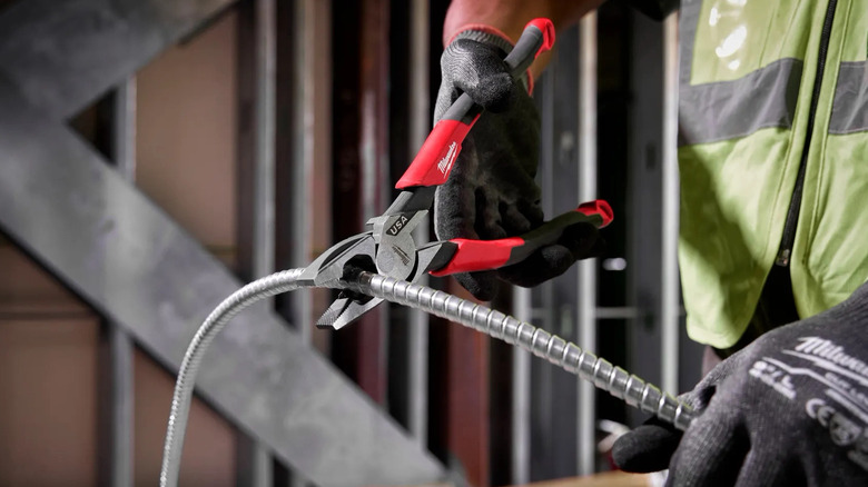 Lineman pliers being used on wire