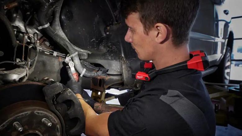 Mechanic wearing a Milwaukee neck light
