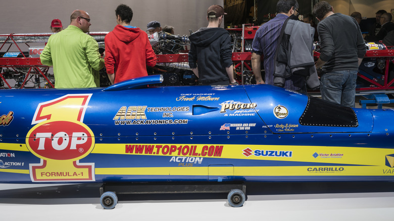 Engineers surround the Ack Attack motorcycle