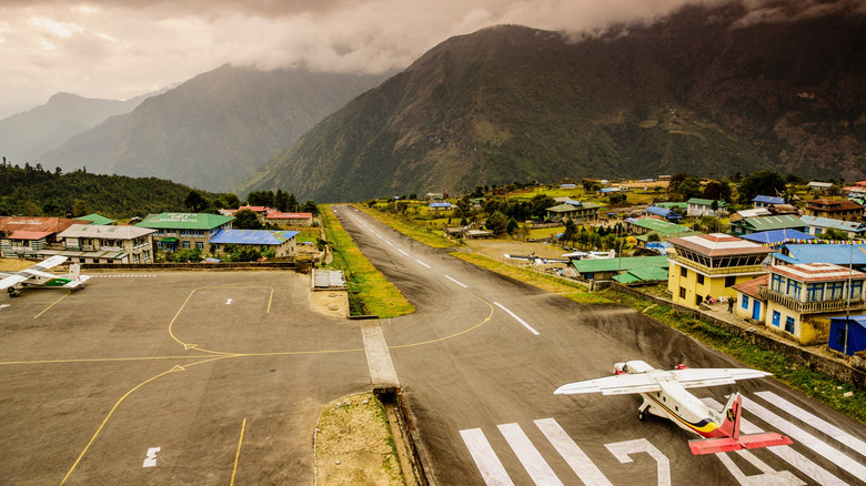 A plane about to take off from Lukla Airport runway