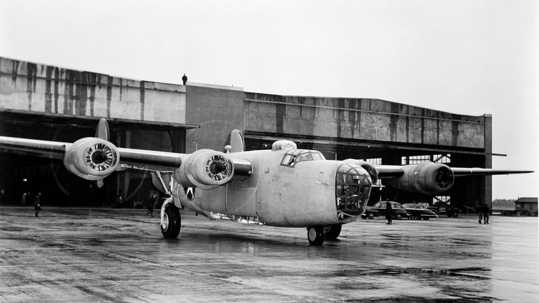 First B-24 ever produced at Willow Run on tarmac in front of Willow Run plant, front-right view