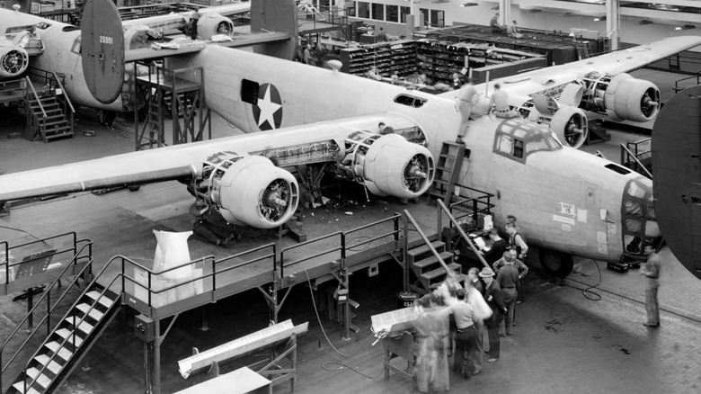 Consolidated B-24 Liberator on engine assembly line at Willow Run plant, front-right view