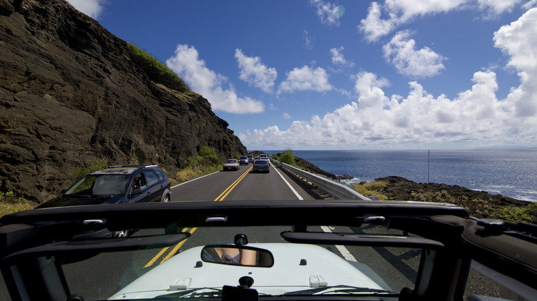 POV driving on hawaii highway near coast