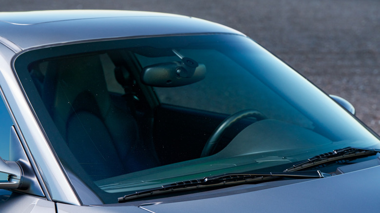 The windshield of a silver car.