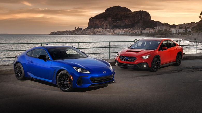 2024 Subaru WRX and 2024 Subaru BRZ parked together, front 3/4 view