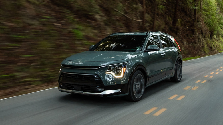 Kia Niro at speed on a country road