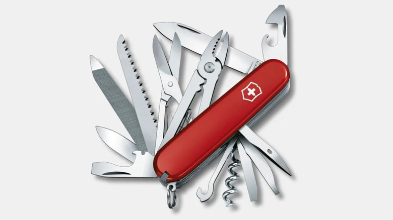 Victorinox Handyman Swiss Army Knife on a white background. All tools are unfolded displaying blades, pliers, scissors, corkscrew and more.