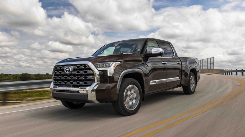 Black Toyota Tundra driving over bridge