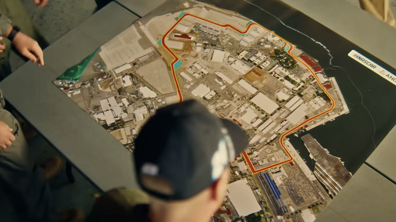 Man in hat looks over map of Coronado race track
