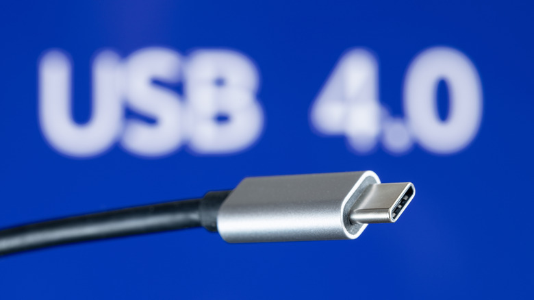USB4 plug cable on blue background with USB 4.0 text