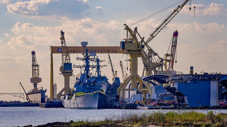 Huntington Ingalls shipyard with a warship under construction