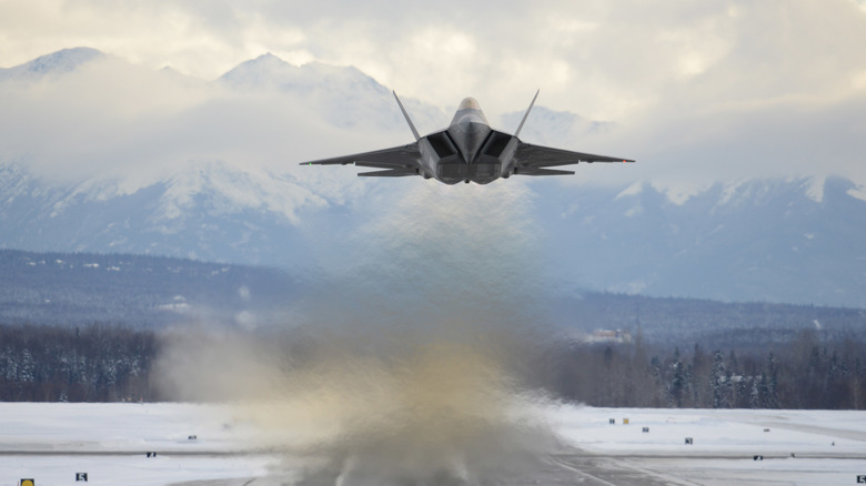 A F-22 Raptor flies over Joint Base Elmendorf-Richardson in Alaska