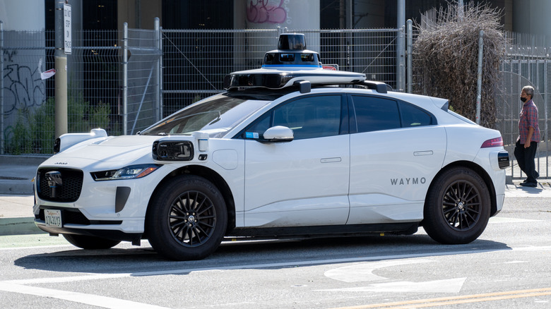 Waymo vehicle moving down street