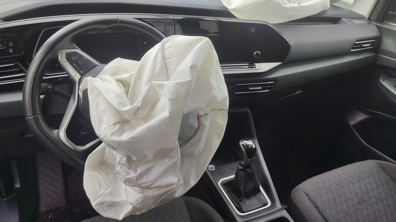 A deployed airbag in a car