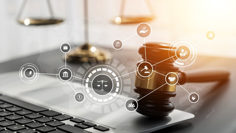 Computer interface graphic with a gavel in foreground
