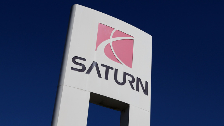 Sign fronting Saturn logo