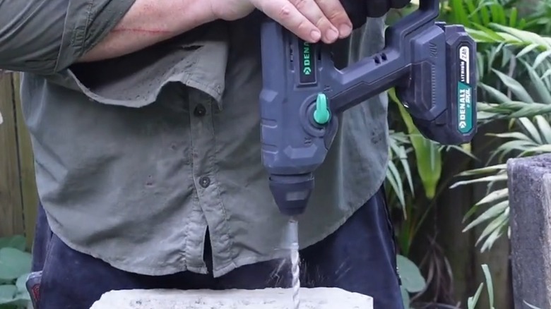 A person using a Denali rotary hammer.