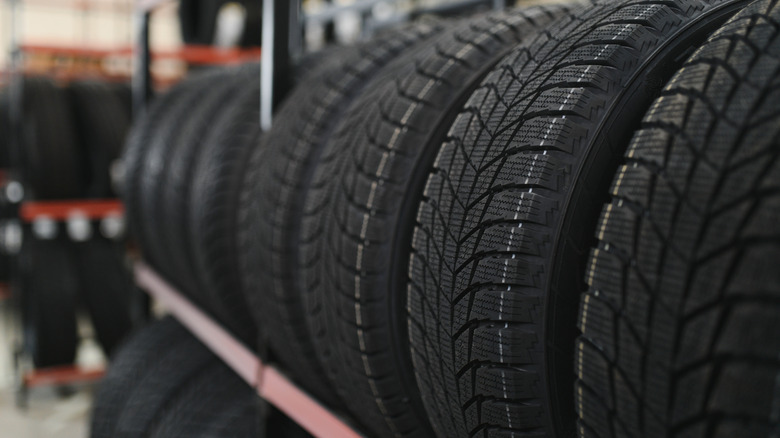 A close-up of tires on a storage rack in a storage facility