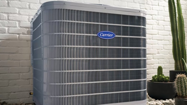 A Carrier air conditioning unit outside.