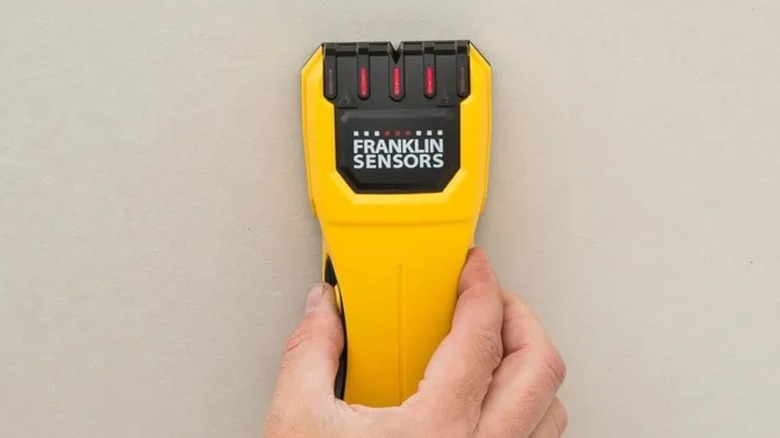 Hand pushes up Franklin Sensors M50