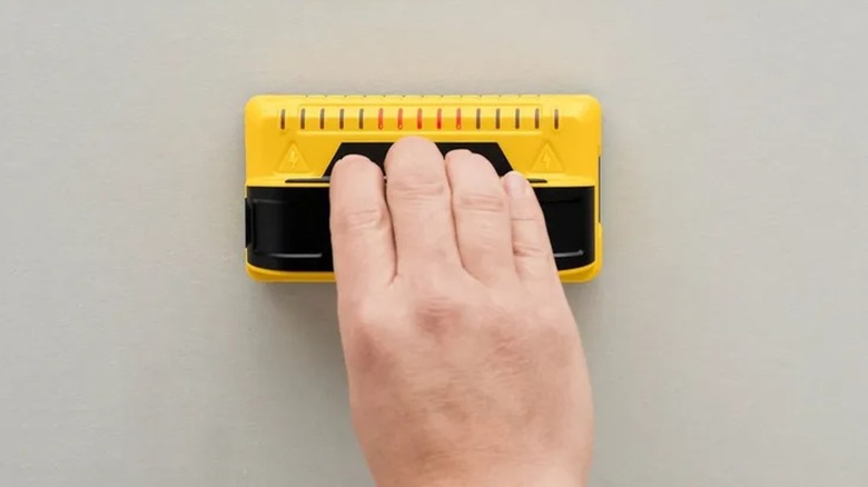 Hand pushes up Franklin Sensors M150