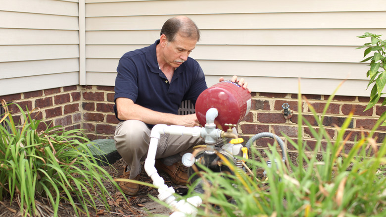 Man installing water pump
