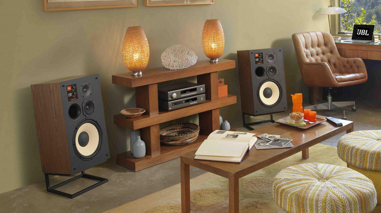 A JBL L100 bookshelf speaker system inside a home setting