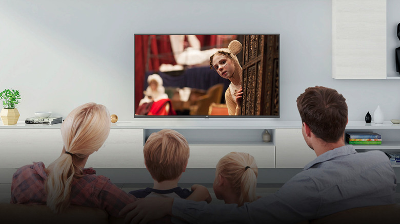 Family watching a JVC TV