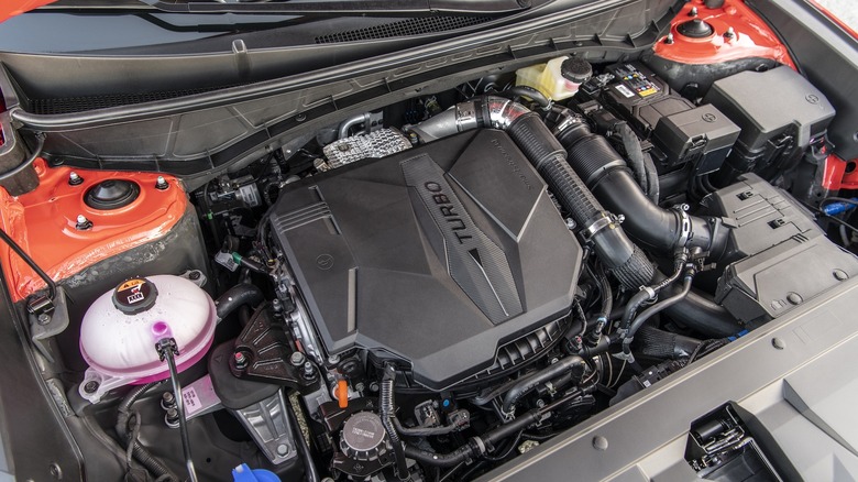 View under the hood of a 2026 Hyundai Santa Cruz showing a 2.5-litre turbocharged engine shared with Kia models.