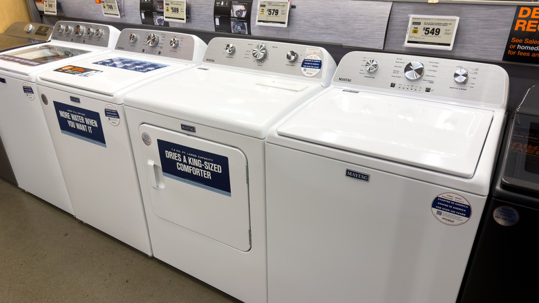 A line of Maytag appliances at a store