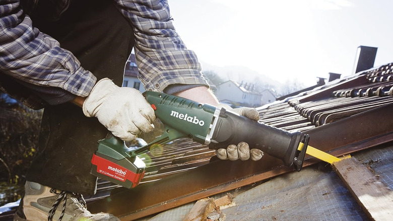 Person using Metabo cordless saw