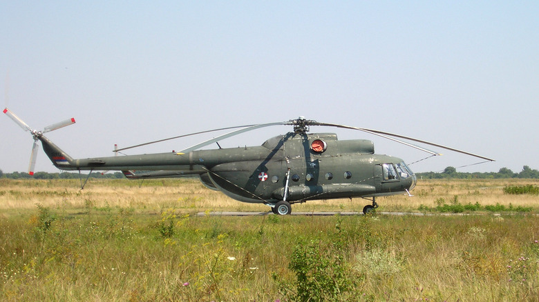 Mil Mi-8 on the ground in a grassy field