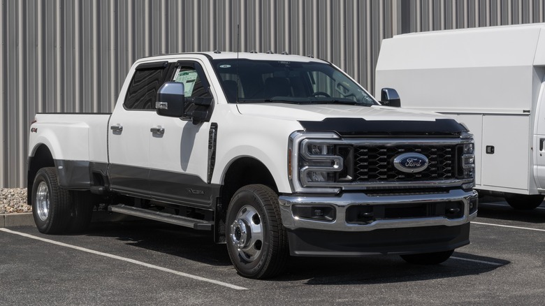 a white Ford F350 Super Duty truck at a parking lot
