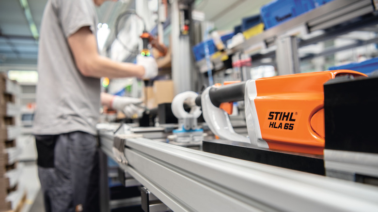 STIHL product with factory worker in the background