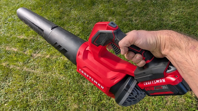 Craftsman leaf blower in hand.