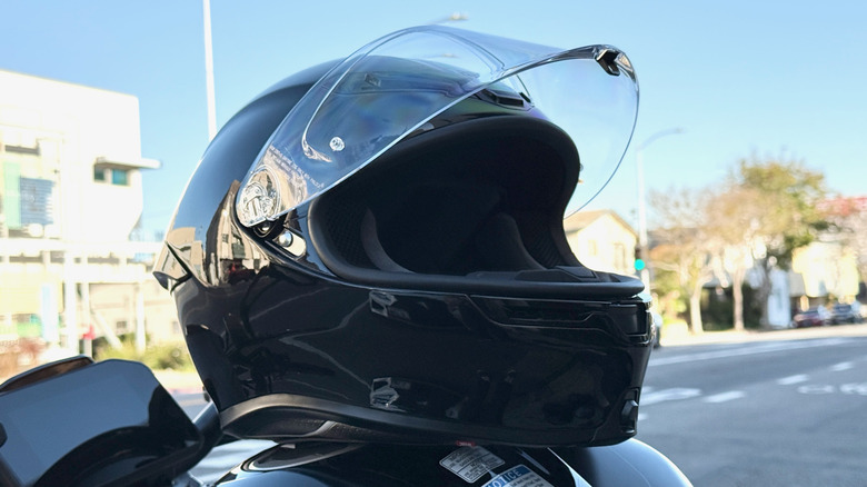 AGV K6 S Helmet on the tank of a motorcycle