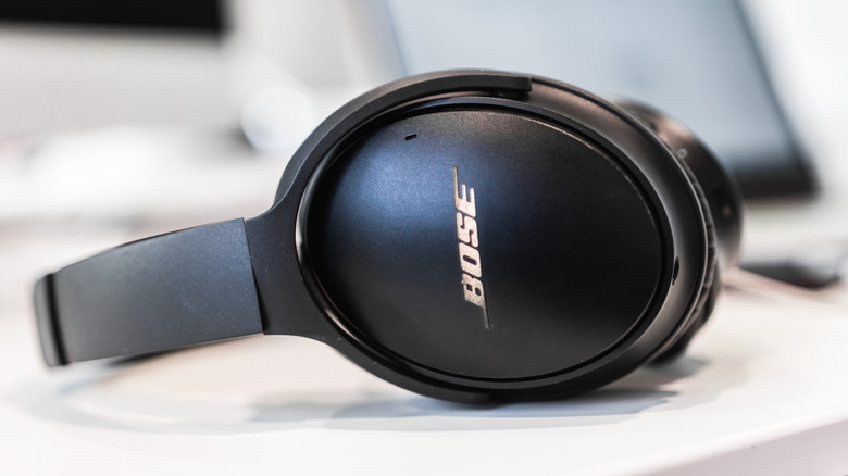Bose headphones laying down on a white table