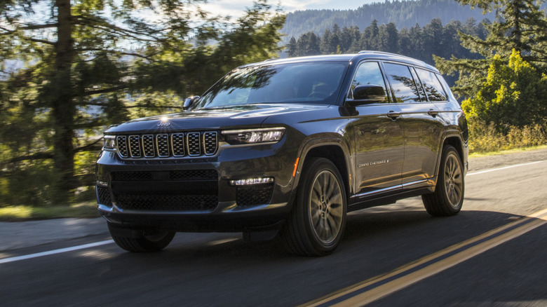 2025 Jeep Grand Cherokee L Summit Reserve driving down the road