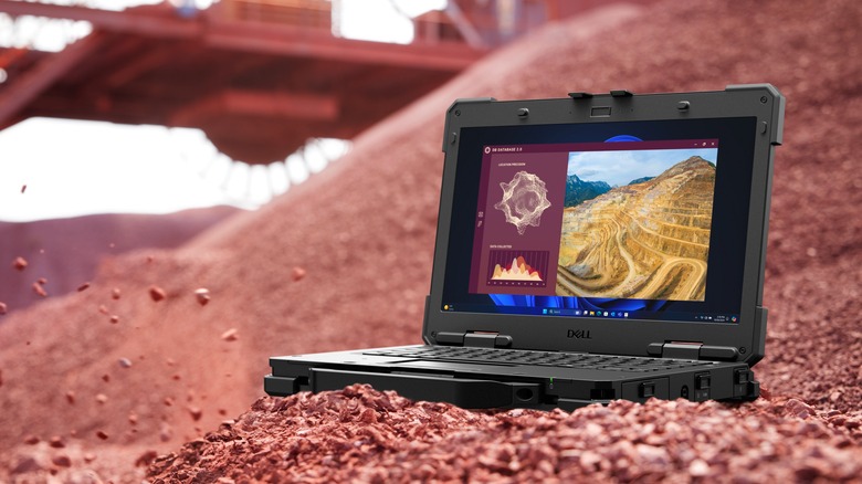 Dell Latitude tough and rugged laptop on rocky red surface