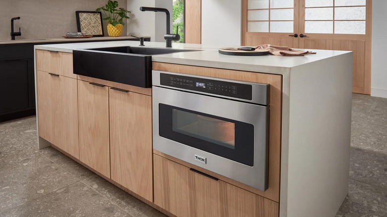 A modern kitchen island featuring Thor appliances