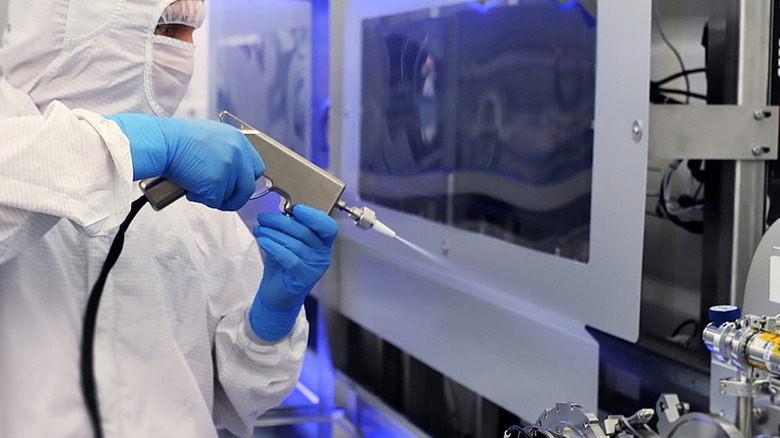 At the Raytheon space factory in Tucson, a technician tests exoatmospheric technology in an ultra-clean environment.