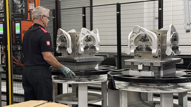TRD employee working on suspension components