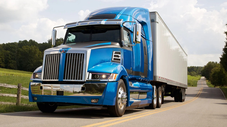 Western Star 5700-series driving along road, front-left view