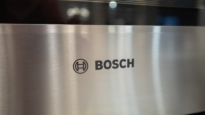 Close-up of the Bosch logo on a silver appliance