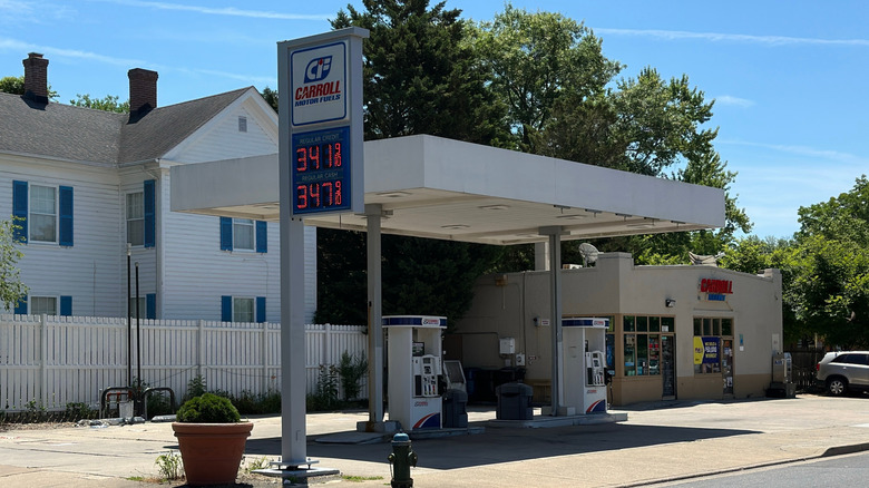 A Carroll Motor Fuels gas station in a suburban setting.
