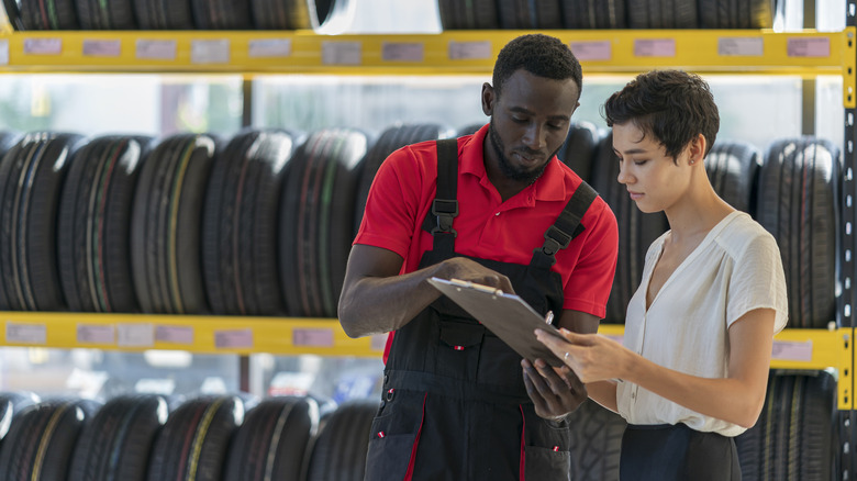Salesman talking with a customer at a tire retailer