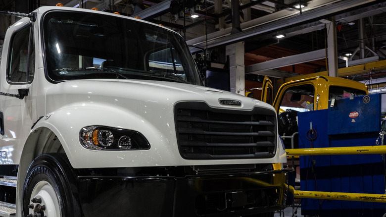 White Freightliner truck inside factory