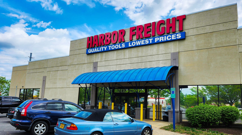 Exterior of a Harbor Freight Tools store with two cars parked out front